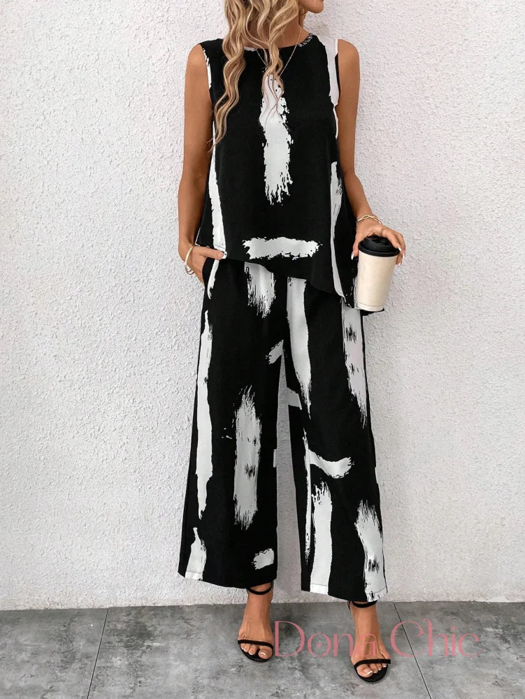 Conjunto Estampado Abstrato Com Blusa Assimétrica E Calça Conjunto Estampado Abstrato Com Blusa Assimétrica E Calça