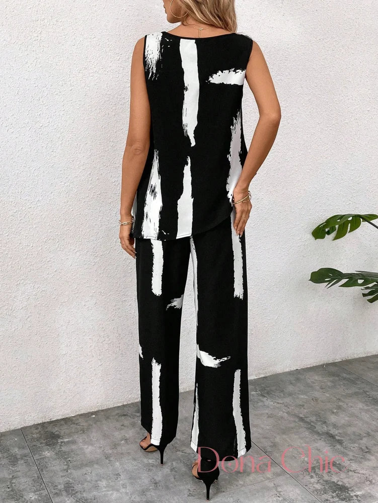 Conjunto Estampado Abstrato Com Blusa Assimétrica E Calça Conjunto Estampado Abstrato Com Blusa Assimétrica E Calça