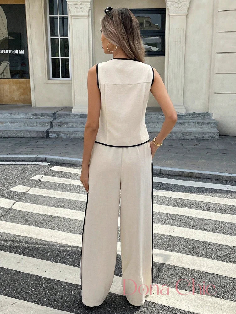 Conjunto Blusa Com Botões E Calça Flare e Cinto Ajustável Conjunto Blusa Com Botões E Calça Flare e Cinto Ajustável
