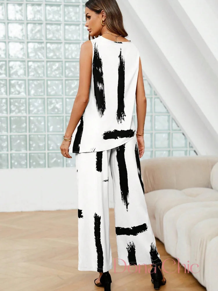 Conjunto Estampado Abstrato Com Blusa Assimétrica E Calça Conjunto Estampado Abstrato Com Blusa Assimétrica E Calça