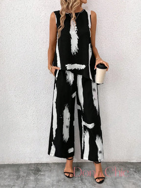 Conjunto Estampado Abstrato Com Blusa Assimétrica E Calça Conjunto Estampado Abstrato Com Blusa Assimétrica E Calça