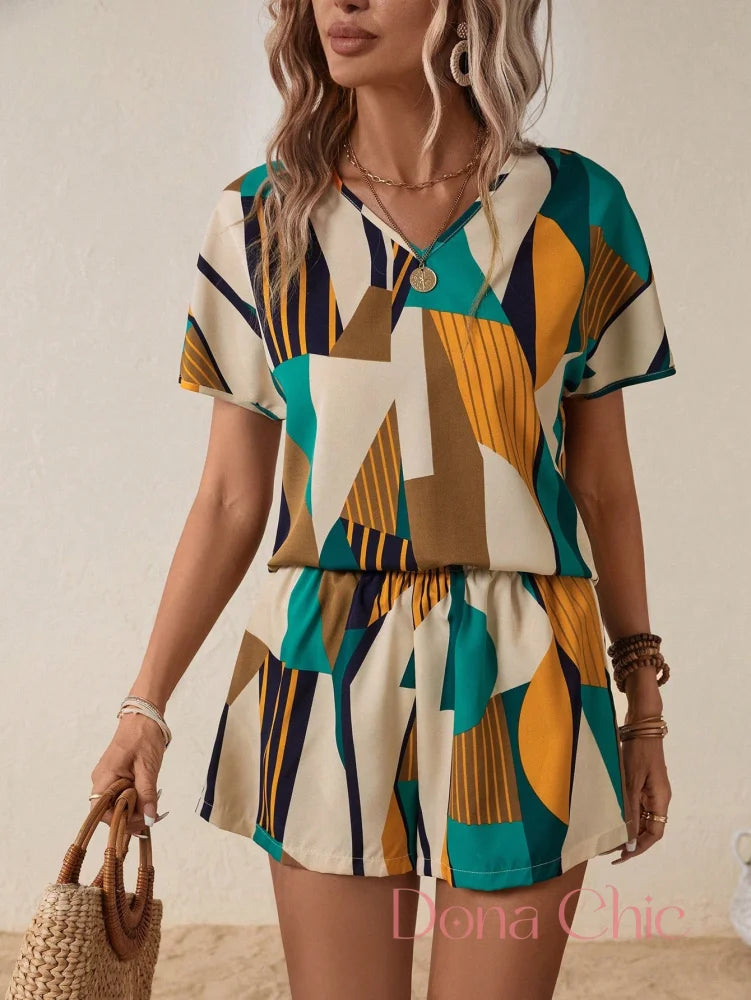 Conjunto Estampado Geométrico Com Caimento Leve Multicolorido / P Conjunto Geométrico com Blusa Manga Morcego e Shorts